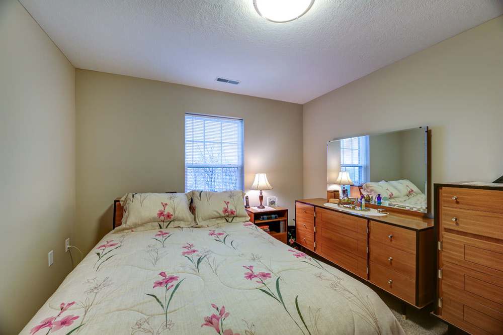 Bedroom with a comfortable bed at Willoughbeach Terrace Senior Living in Willowick, Ohio 