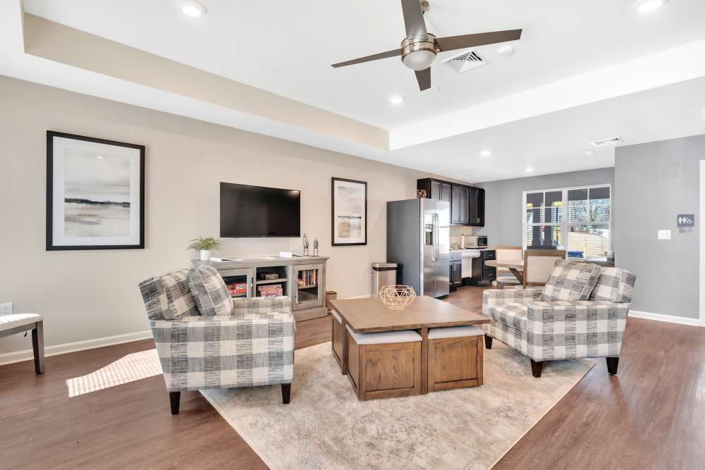 Modern living room with stainless-steel appliances at Rivergate Greene in Charlotte, North Carolina