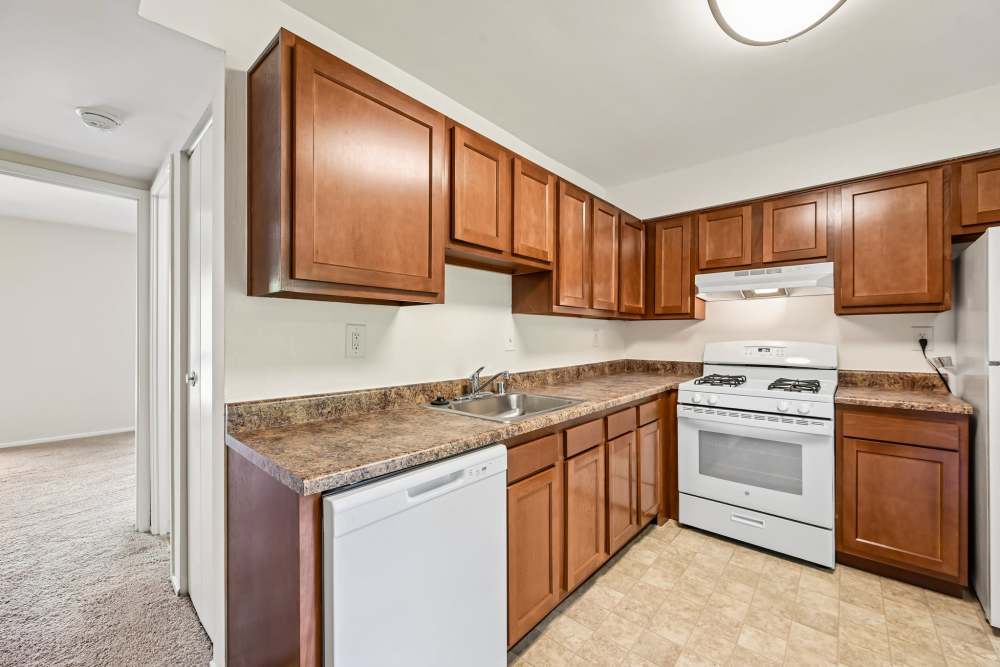 Kitchen with wooden cabinets at Columbia Landing in Columbia, Maryland 