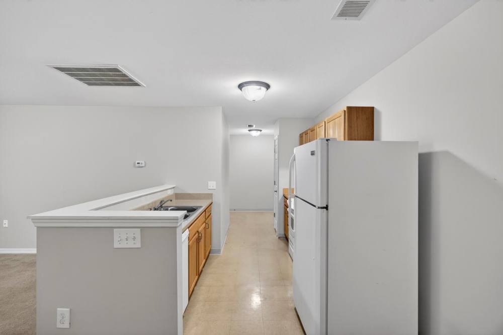 Kitchen with granite countertops and stainless steel appliances at Crowfield Greene in Goose Creek, South Carolina