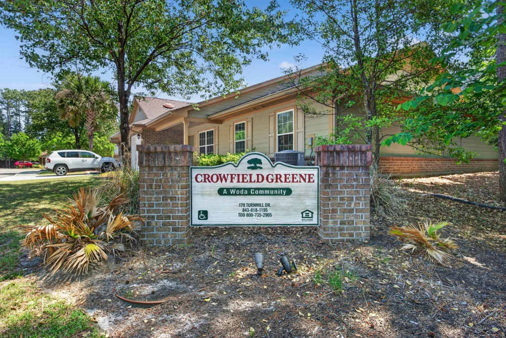 Community entrance sign with landscaping at Crowfield Greene in Goose Creek, South Carolina