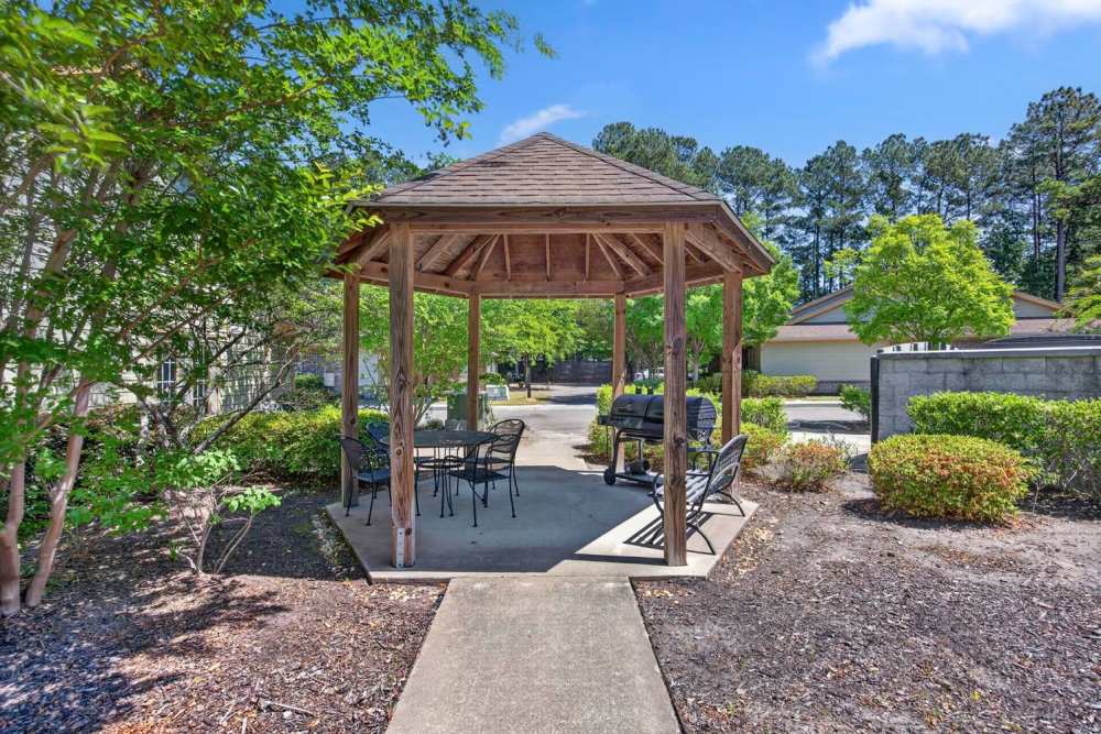 Gazebo with seating area surrounded by greenery at Crowfield Greene in Goose Creek, South Carolina