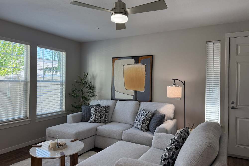 Living room with a comfortable couch at The Enclave in Meridian, Idaho