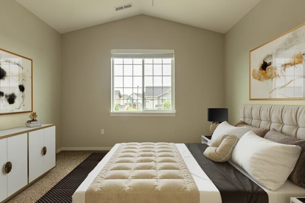 Bedroom with a comfortable bed at The Enclave in Meridian, Idaho