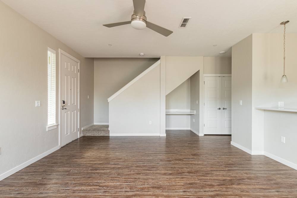 Living room with stair leading to the above floor at The Enclave in Meridian, Idaho