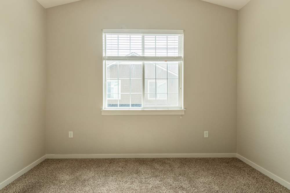 Bedroom with a window at The Enclave in Meridian, Idaho