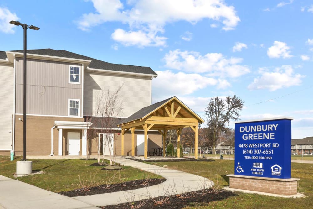 Building exterior with a signboard at Dunbury Greene in Columbus, Ohio 