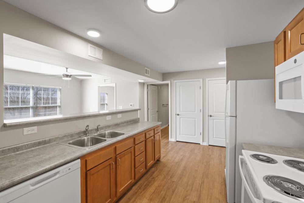 Kitchen with wooden cabinets at Dunbury Greene in Columbus, Ohio 