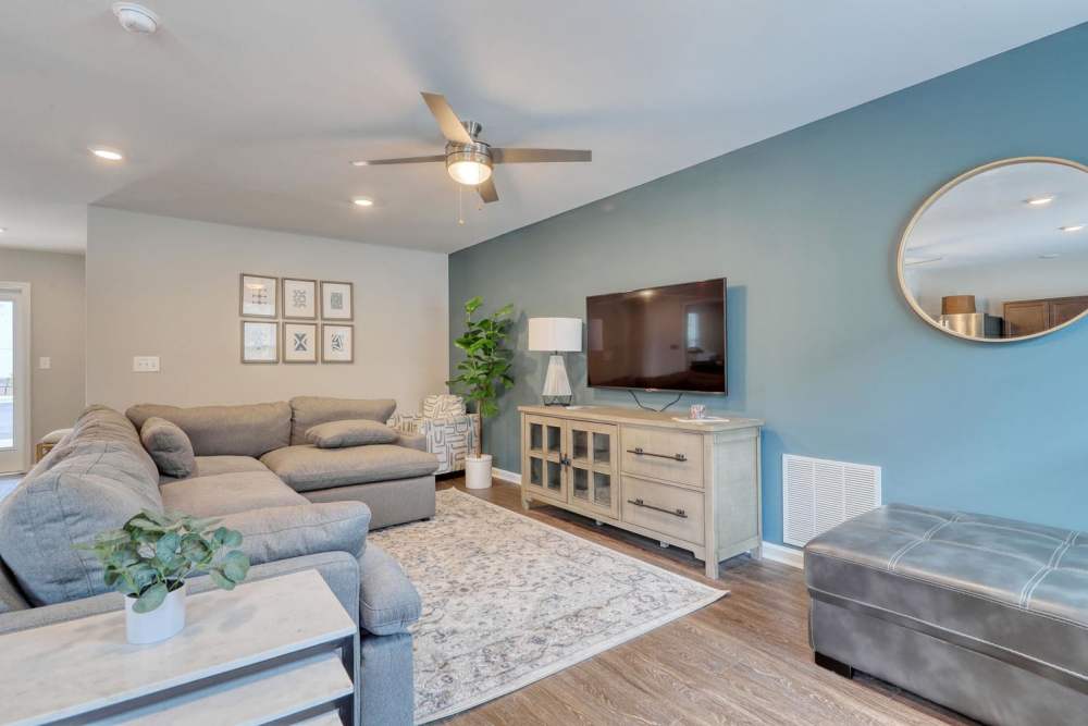 Cozy community living room with sectional sofa at Harbor Meadows in Calabash, North Carolina