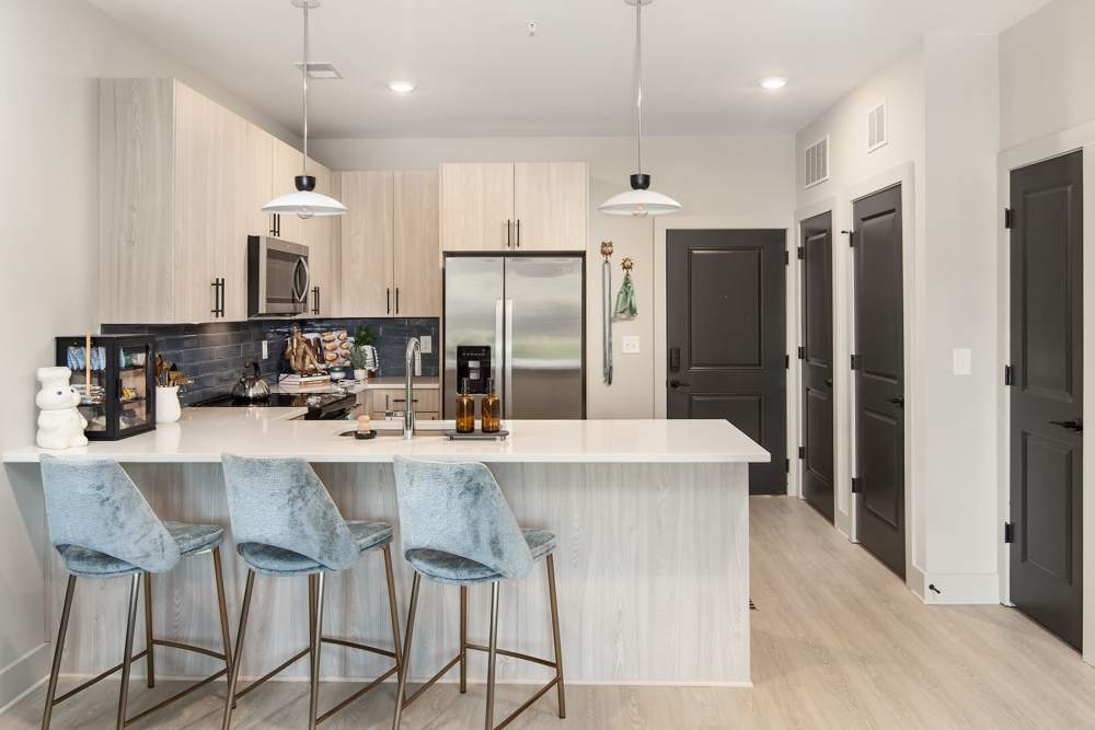 Full appliance package with sit up bar in every apartment home at Cypress Point near Lake Norman