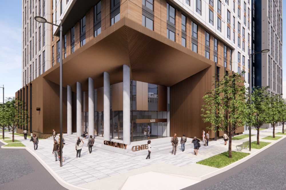 
Corner view of The Exchange at Spring Hill Station exterior with modern architecture, elevated entrance, and pedestrian plaza in Tysons