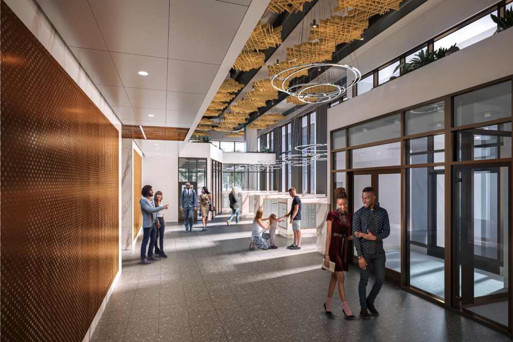 Residential lobby and mailroom area at The Exchange at Spring Hill Station with modern lighting, wood finishes, and package storage