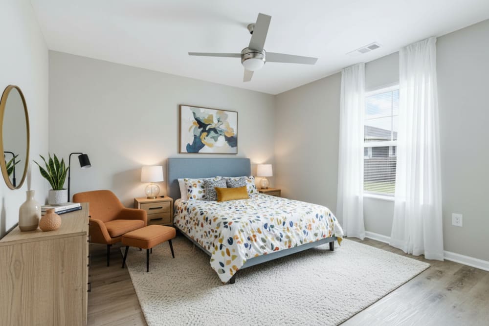 Well-furnished bedroom at Carmichael Commons in Madison, Georgia