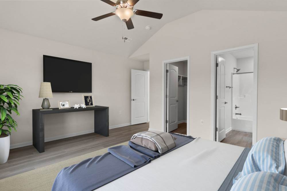 Modern bedroom at Crystal Lake & Kingsley Apartments and Townhomes in Fayetteville, North Carolina