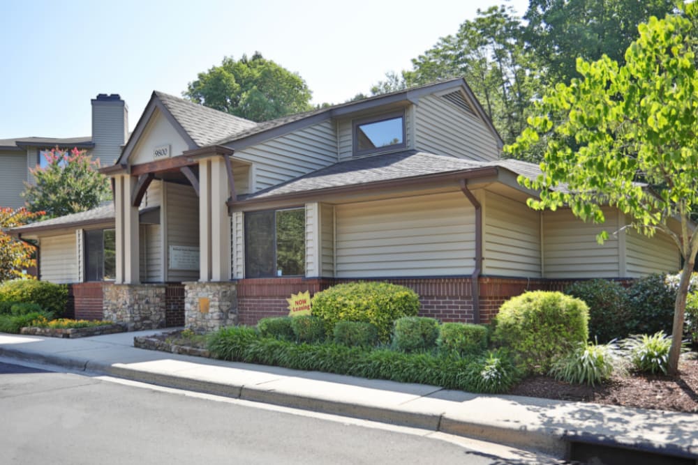 Clubhouse exterior with landscaped entrance at Niner Woods in Charlotte, North Carolina
