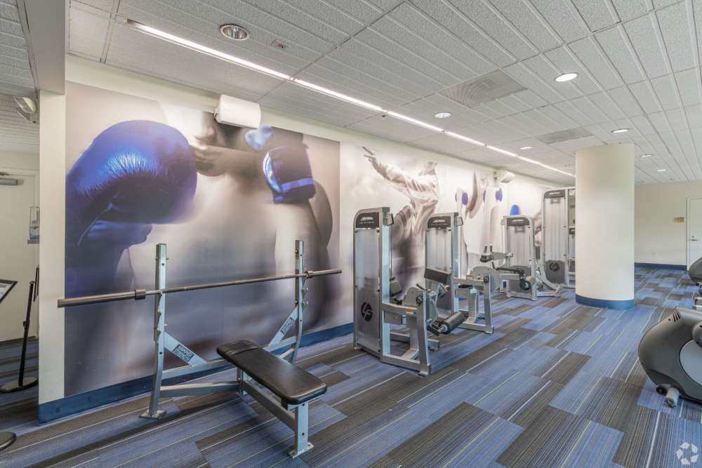 Weight lifting equipment in the fitness center at The Residences at Christina Landing in Wilmington, Delaware