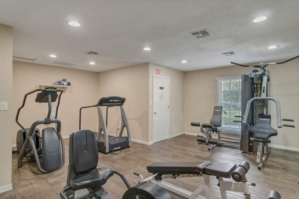 Fitness center with proper lighting and a window at Carlton Arms Of St. Petersburg in St Petersburg, Florida 
