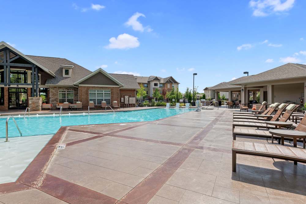 Resort style swimming pool with lounge seating at Langford in , North Carolina