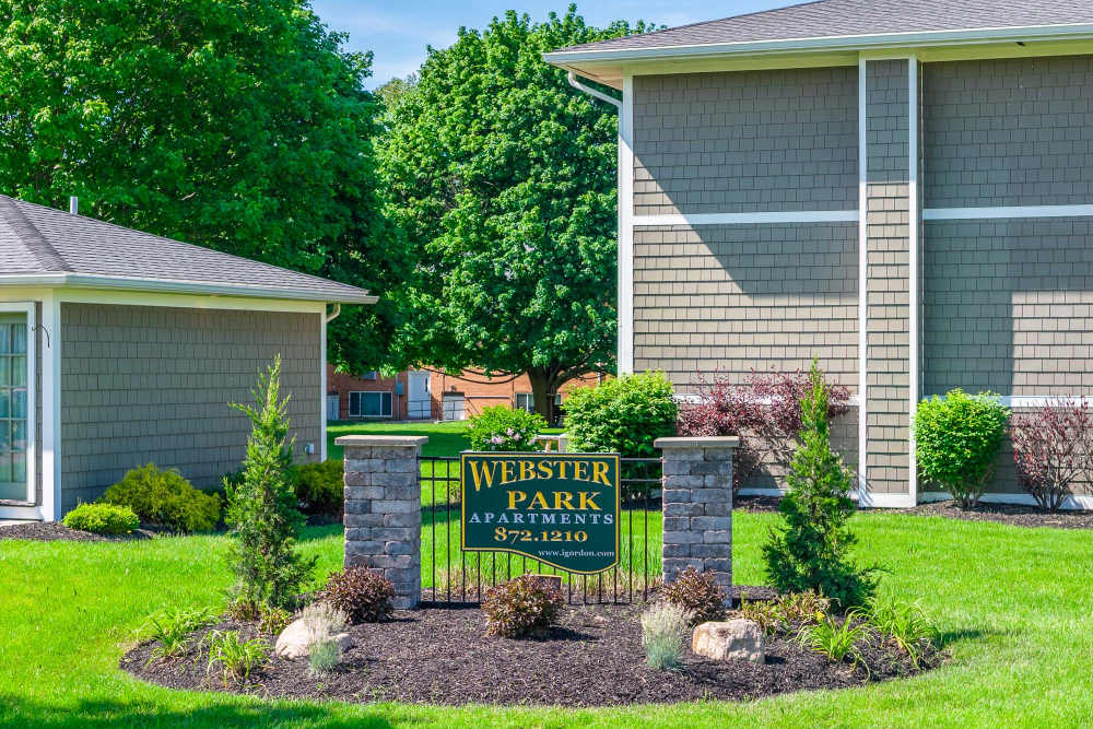 Webster Park Apartments sign in landscaped lawn at Webster Park in Webster, New York
