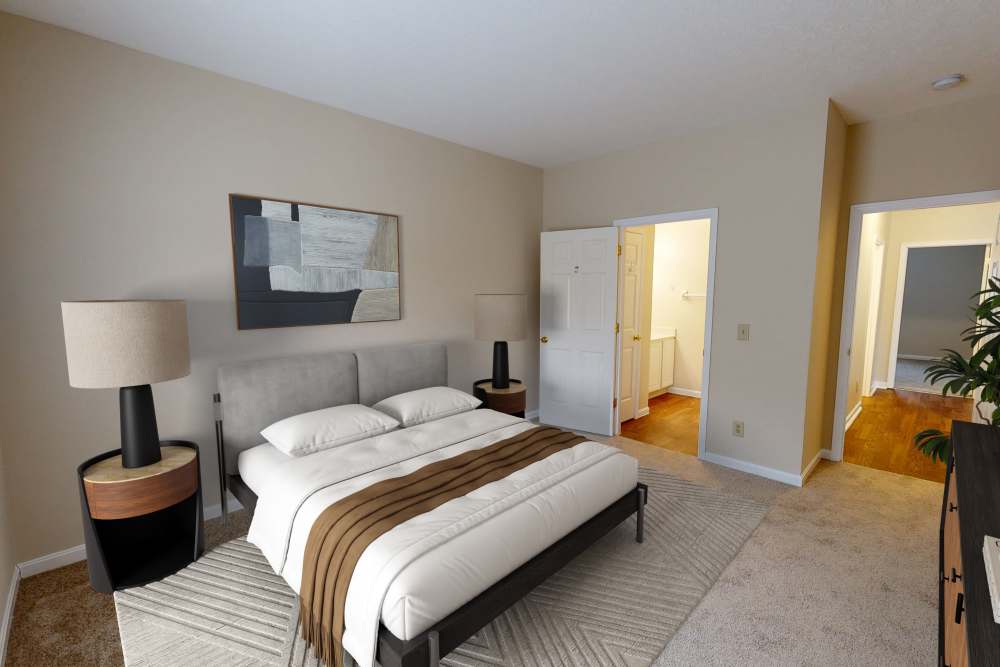 Cozy bedroom with neutral tones and modern decor at Whispering Wind Apartments & Townhomes in Newtown, Ohio