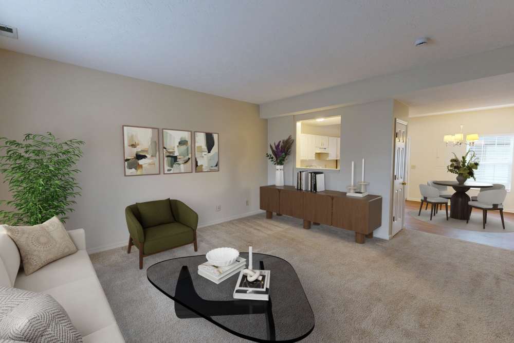 Open layout living room with modern decor at Whispering Wind Apartments & Townhomes in Newtown, Ohio