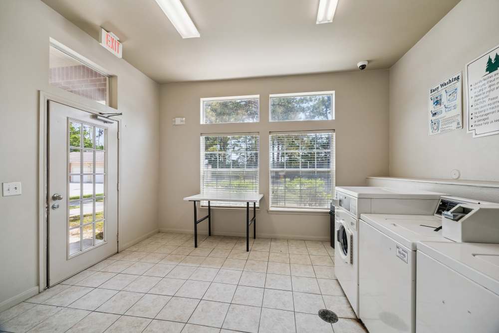 Community laundry area at Montgomery Pines Apartments in Porter, Texas