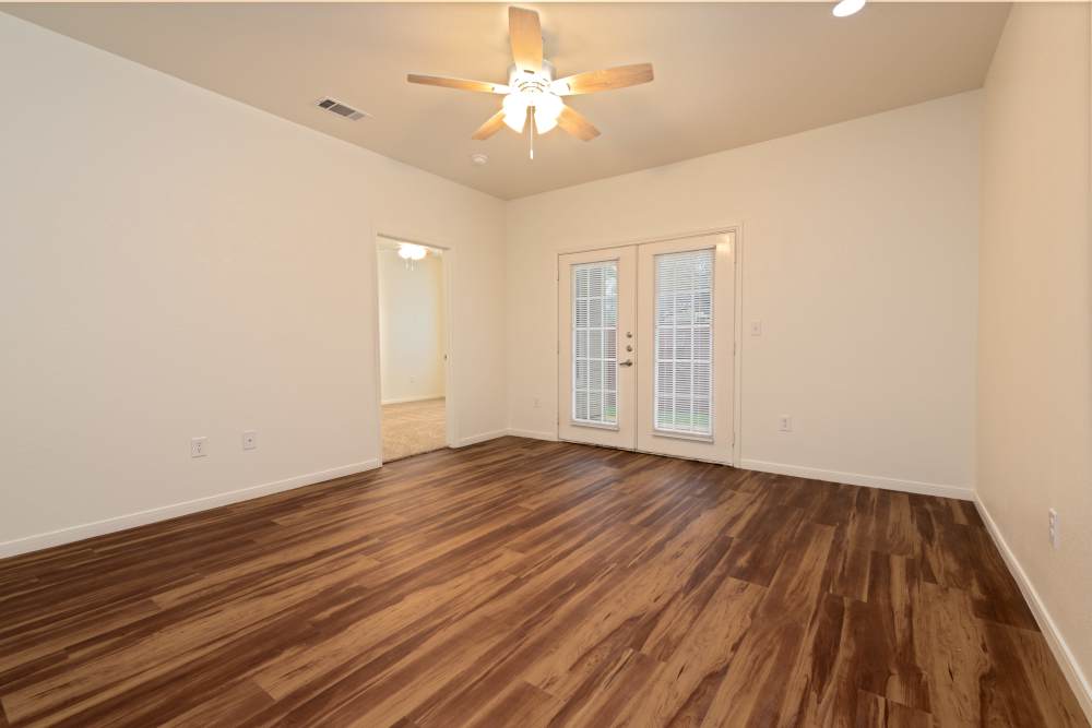 Unfurnished living room with access to bedroom at The Arbors at Rose Park in Abilene, Texas