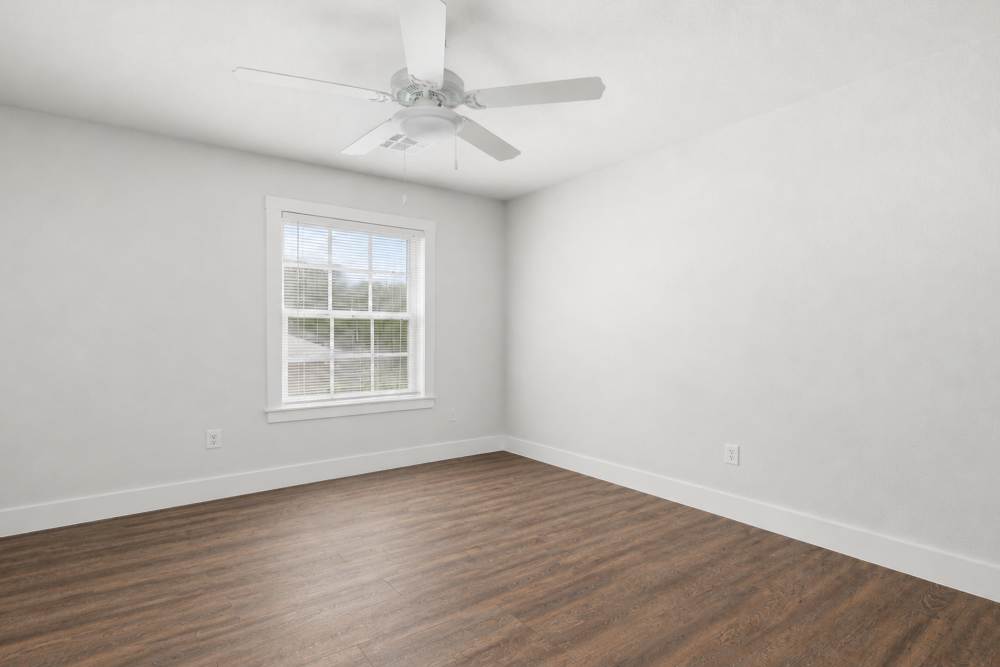 Bedroom with a window at Covington Woods II in Lansing, Kansas 