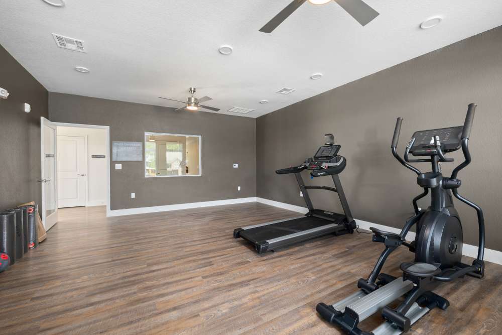 Fitness center with treadmills at Covington Woods II in Lansing, Kansas 
