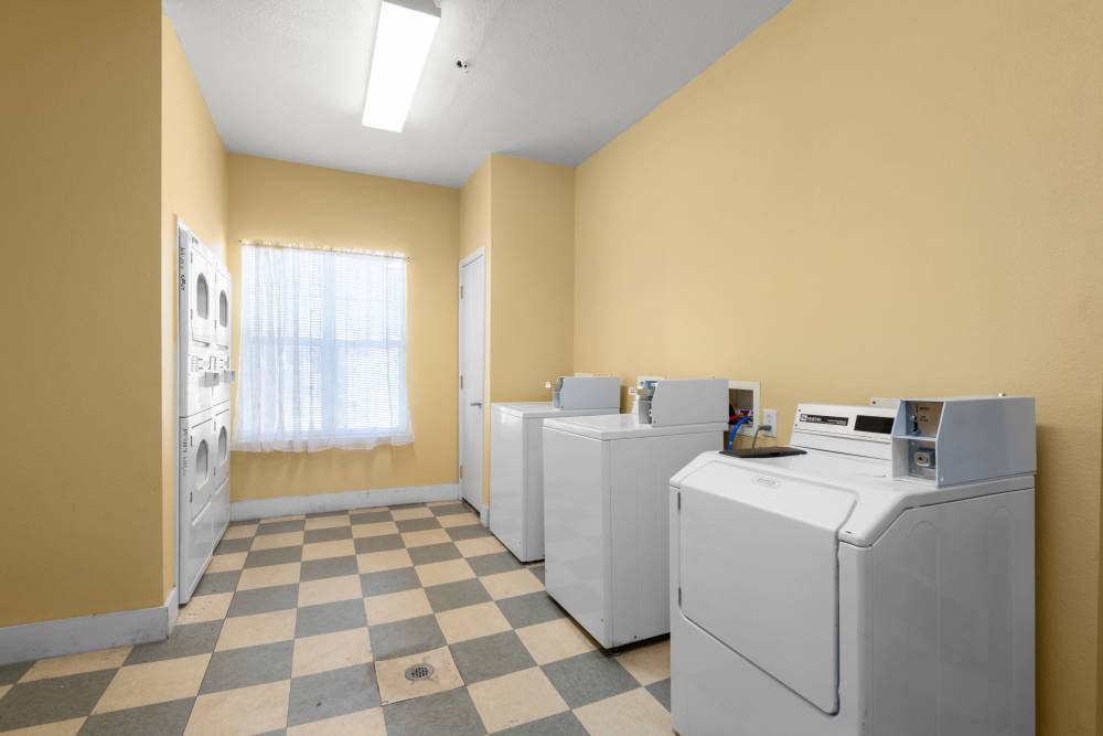 Laundry room at The Arbors at Rose Park in Abilene, Texas