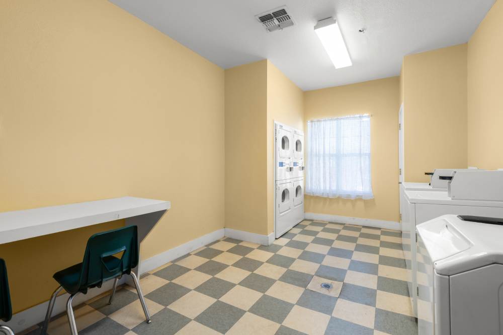 Laundry room with washer and dryer at The Arbors at Rose Park in Abilene, Texas