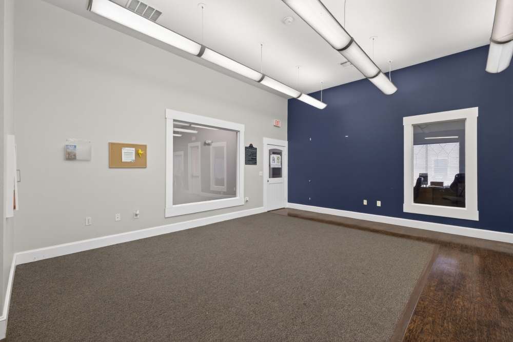 Clubhouse interior with carpeted flooring at Rosemont At Lakewest in Dallas, Texas