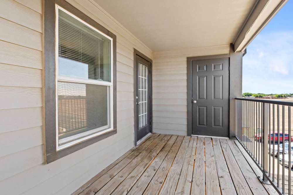 Patio with wooden flooring at Stone Canyon Apartments in Amarillo, Texas 