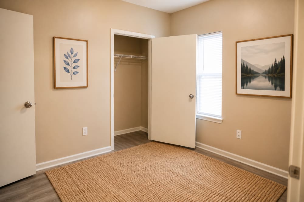 Bedroom with a closet at Riverchase Park Apartments in Gulfport, Mississippi 