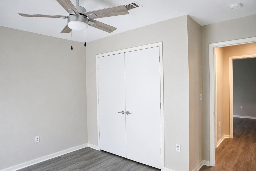 Unfurnished bedroom with wood-style flooring at Lincoln Estates in Carthage, Mississippi