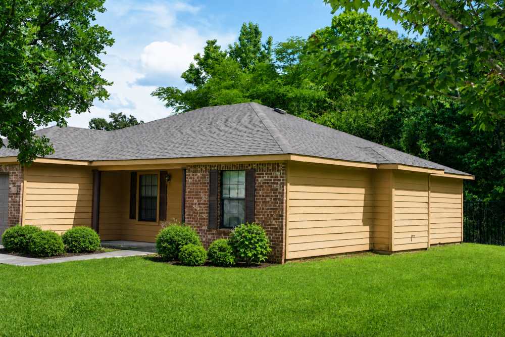 Exterior view of building with trees at Lincoln Estates in Carthage, Mississippi