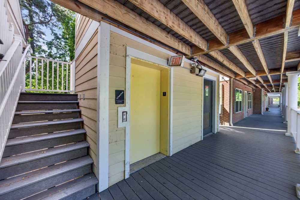 Elevator entrance and stairway at apartment community at Pinecrest Greene in Charleston, South Carolina