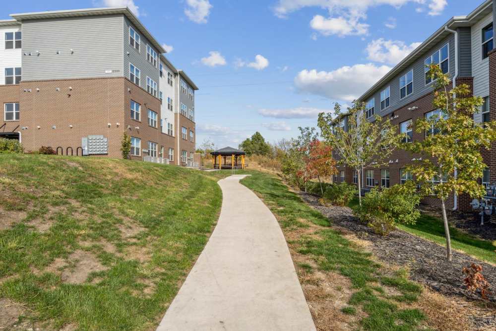Pathway leading to apartment buildings at Johnston Crossing II in Johnston, Iowa