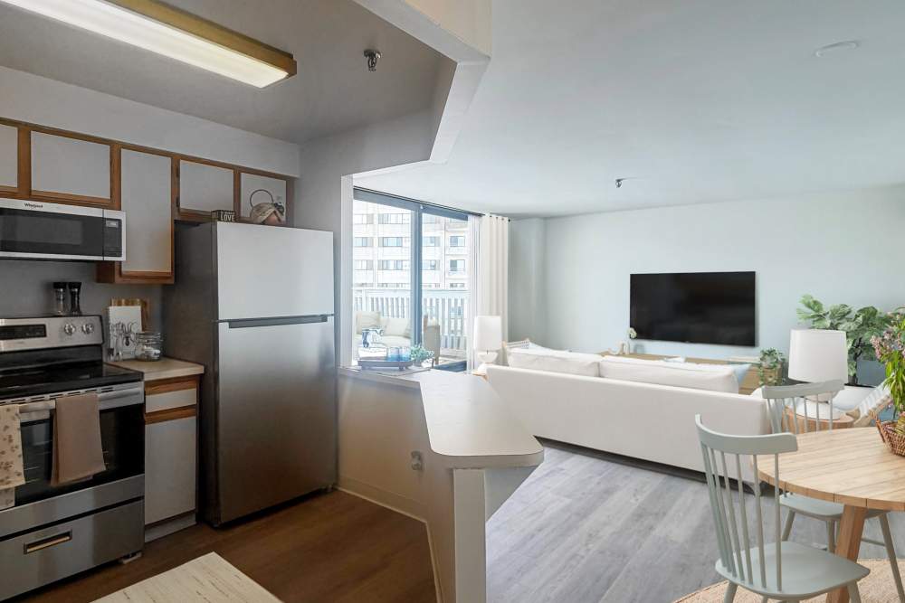  Living area with balcony and TV at BLU Revere in Revere, Massachusetts