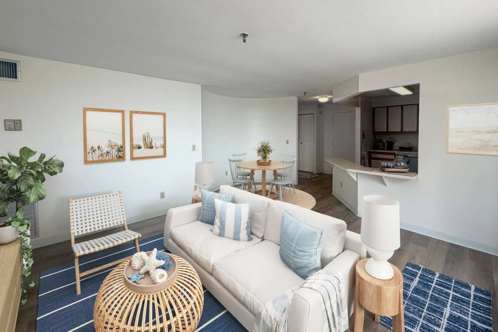 Living room with sofa and dining area at BLU Revere in Revere, Massachusetts