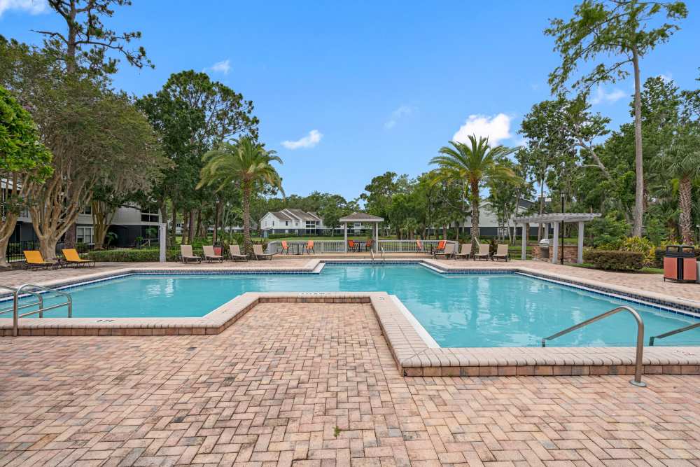 Sparkling pool with lounge chairs at Lake Forest in Daytona Beach, Florida