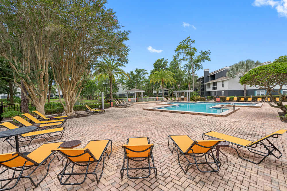 Lounge chairs by sparkling pool at Lake Forest in Daytona Beach, Florida