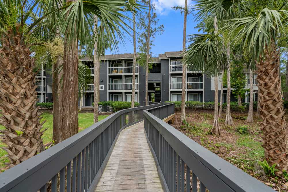 Wooden walkway leading to apartment building at Lake Forest in Daytona Beach, Florida