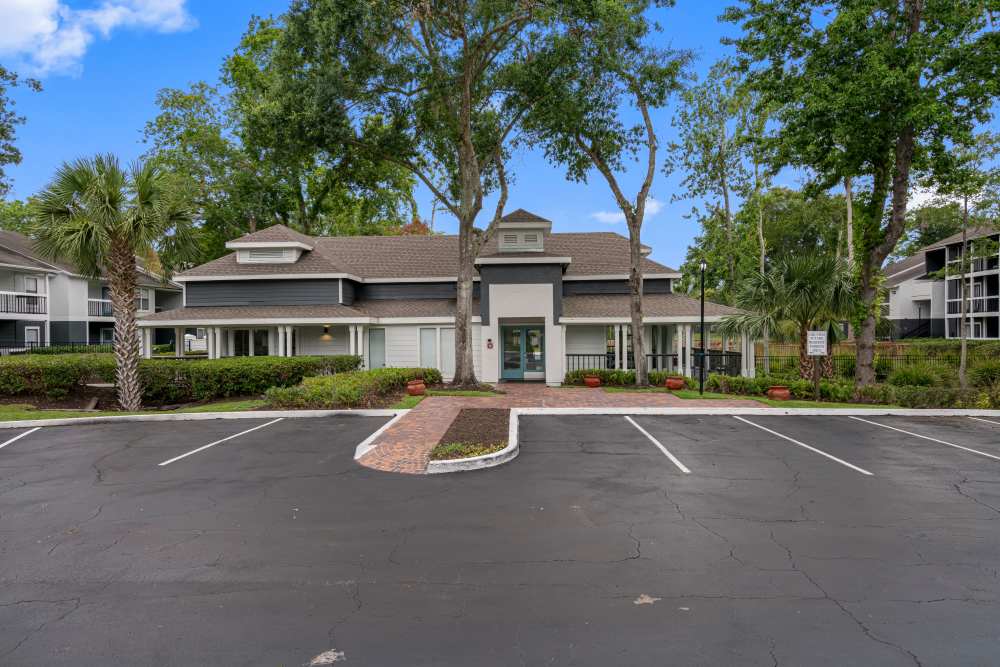 Gated entrance with lush landscaping at Lake Forest in Daytona Beach, Florida
