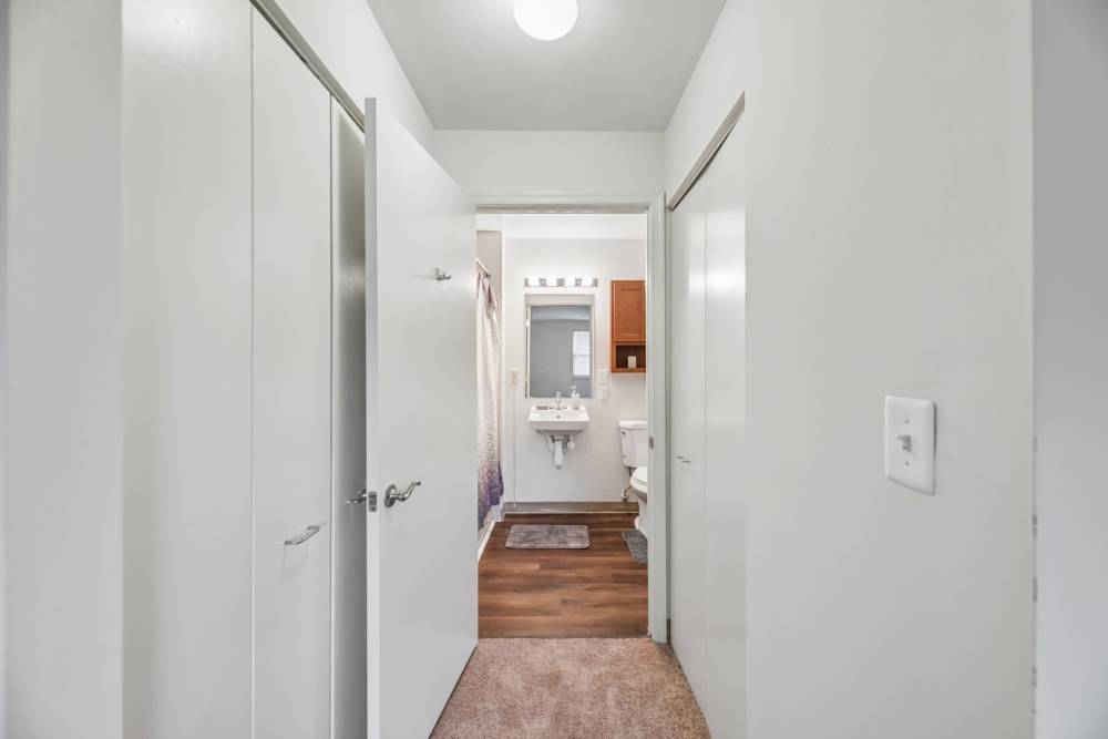 Bedroom with attached bathroom at Randolph Village Senior Apartments in Silver Spring, Maryland 