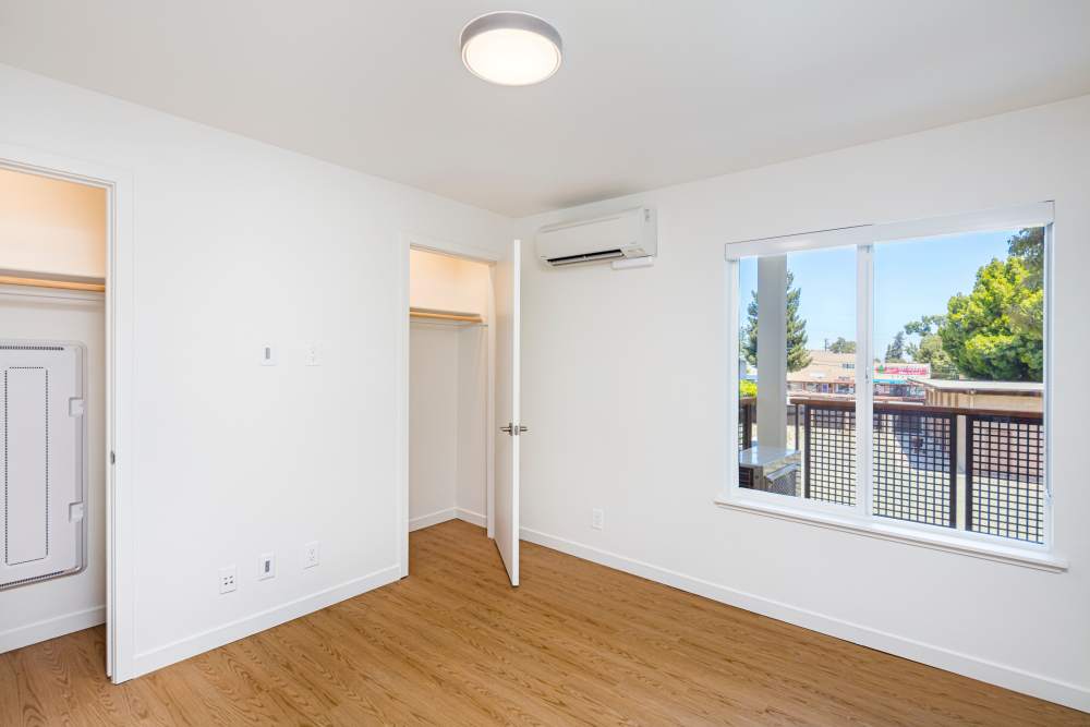 Bright bedroom with wood-style flooring at 707 Leahy in Redwood City, California