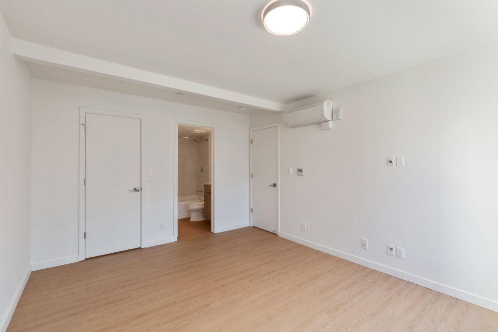 Spacious unit interior with wood-style flooring at 707 Leahy in Redwood City, California