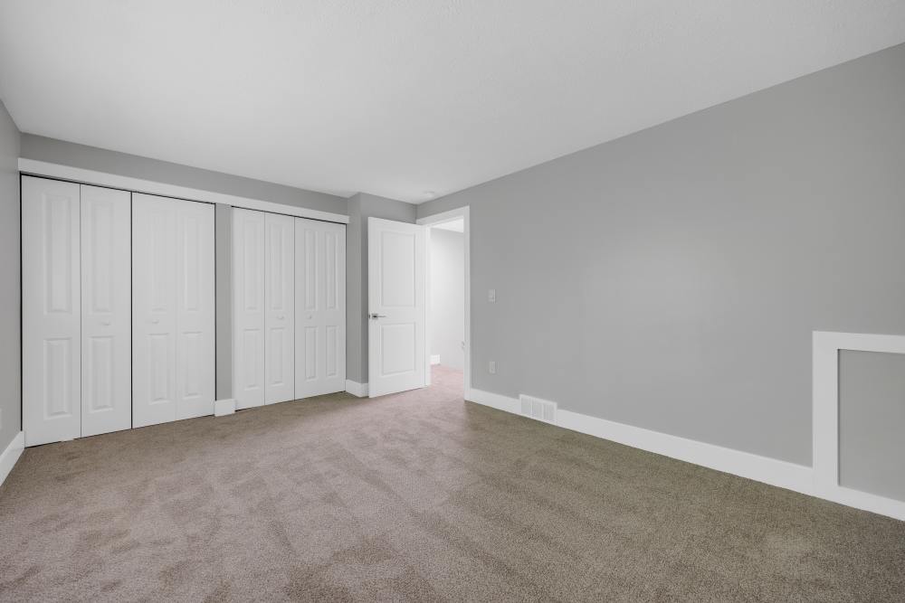 Open layout bedroom with carpet at Valley Brook Townhomes in Rochester, New York