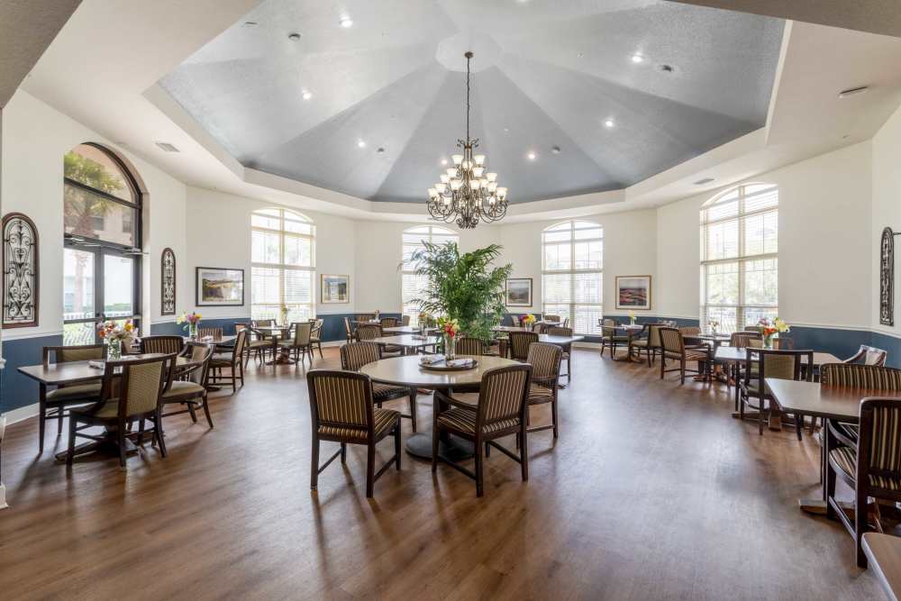 Spacious resident dining area at Merrill Gardens at Solivita Marketplace in Kissimmee, Florida. 
