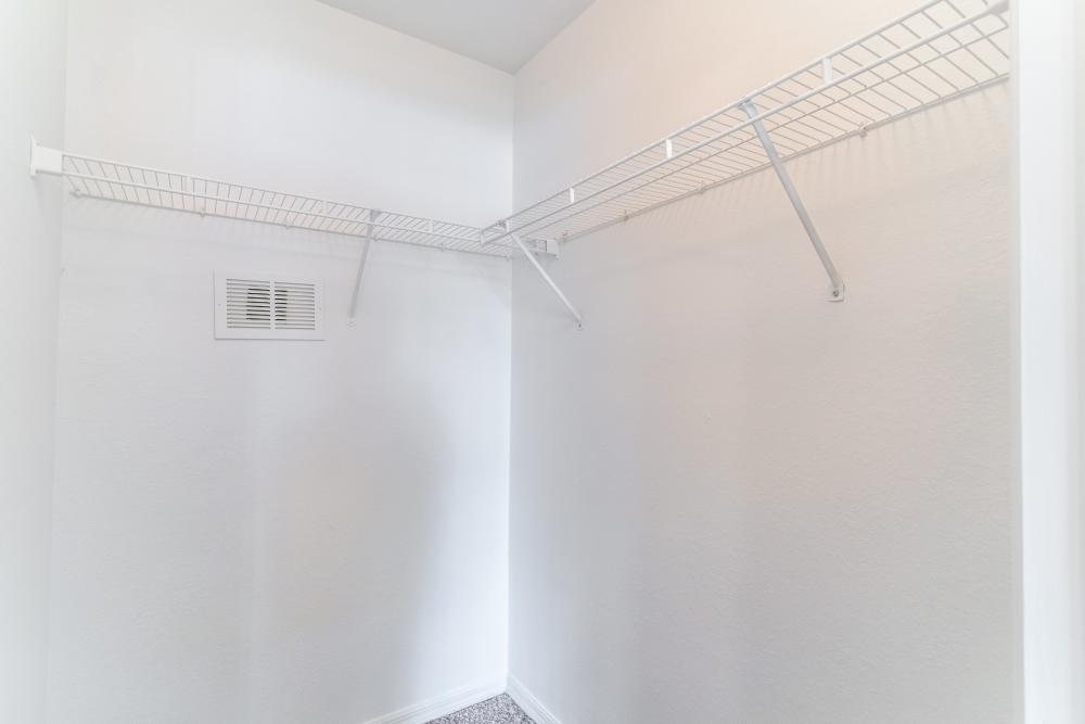 Walk-in closet with wire shelving at Newport Sound Apartments in New Smyrna Beach, Florida